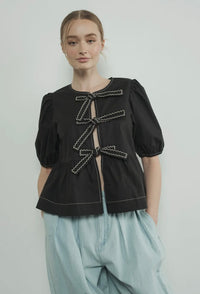 Embroidered Bow Tie Peplum Blouse